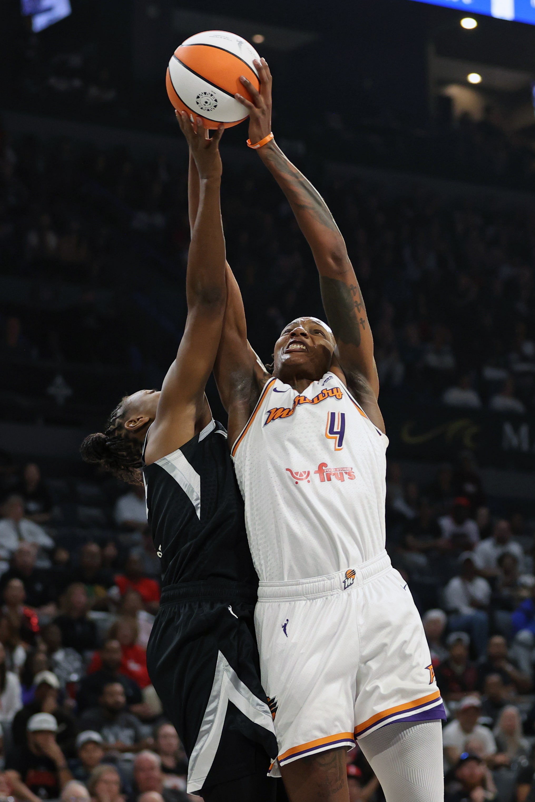 Natasha Mack #4 of the Phoenix Mercury grabs the rebound during the game against the Las Vegas Aces