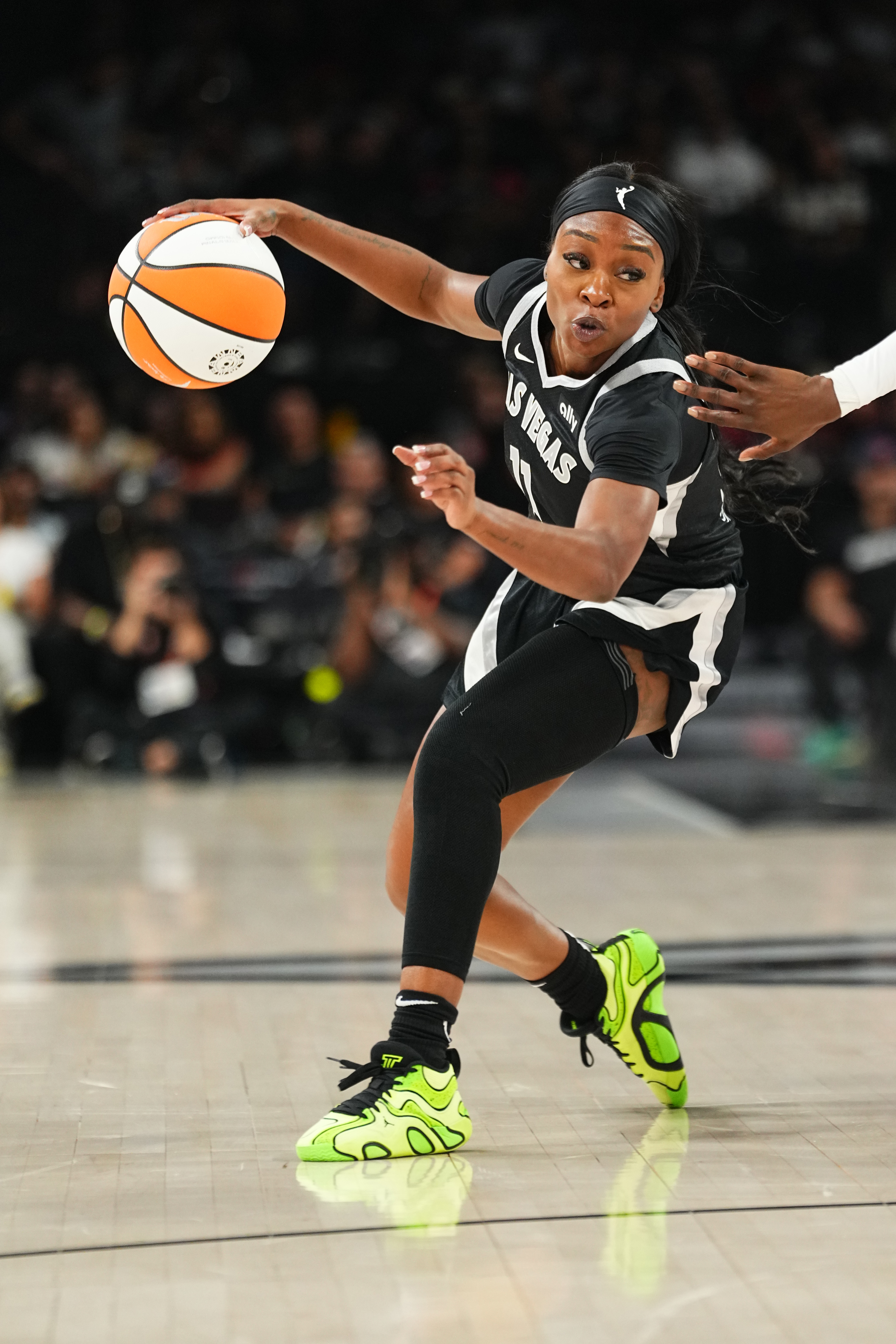 Dana Evans #11 of the Las Vegas Aces dribbles the ball during the game against the Phoenix Mercury