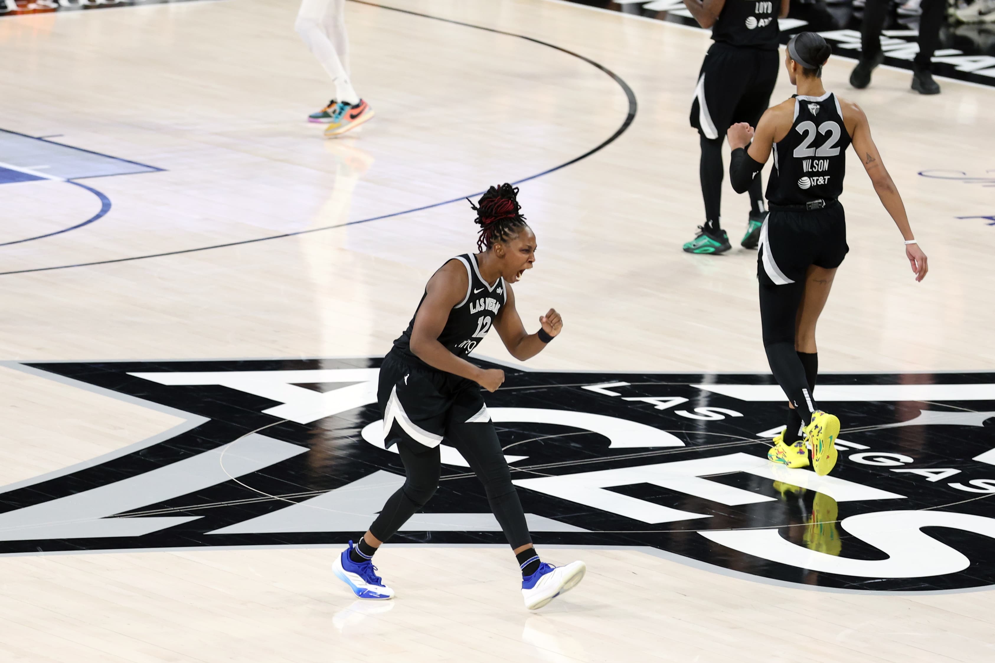 Chelsea Gray #12 of the Las Vegas Aces celebrates during the game against the Phoenix Mercury