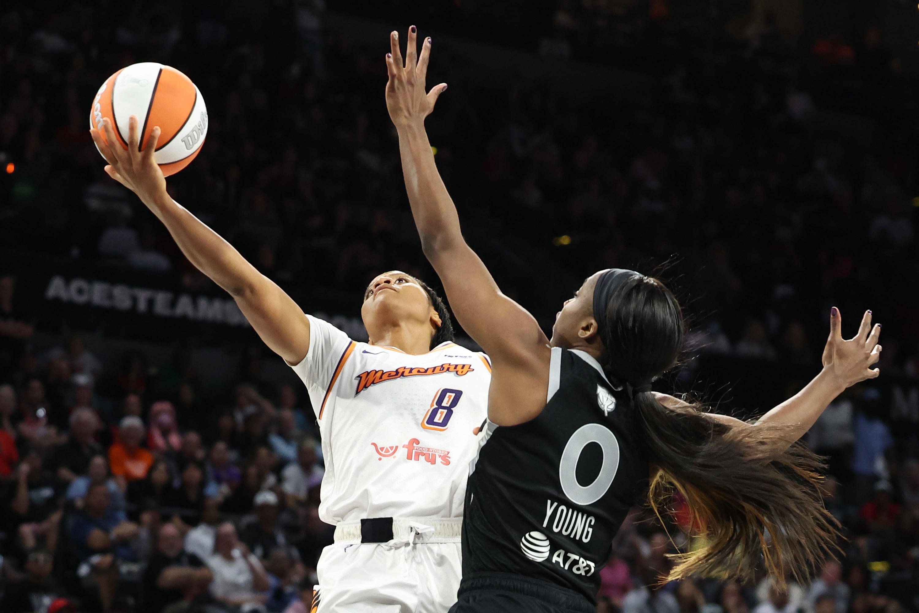 Monique Akoa Makani #8 of the Phoenix Mercury shoots the ball against Jackie Young #0 of the Las Vegas Aces