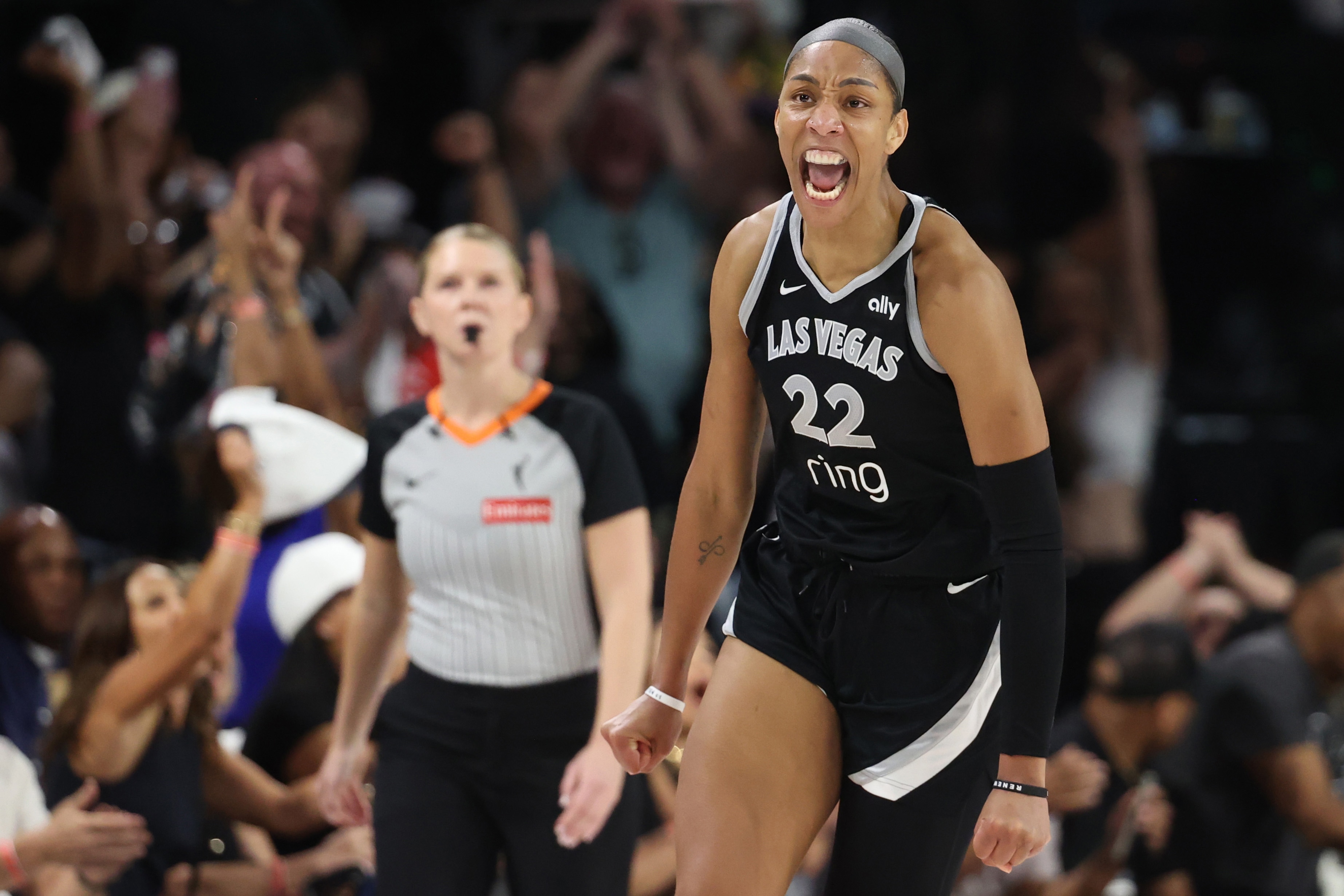 A'ja Wilson #22 of the Las Vegas Aces celebrates after making a basket against the Phoenix Mercury