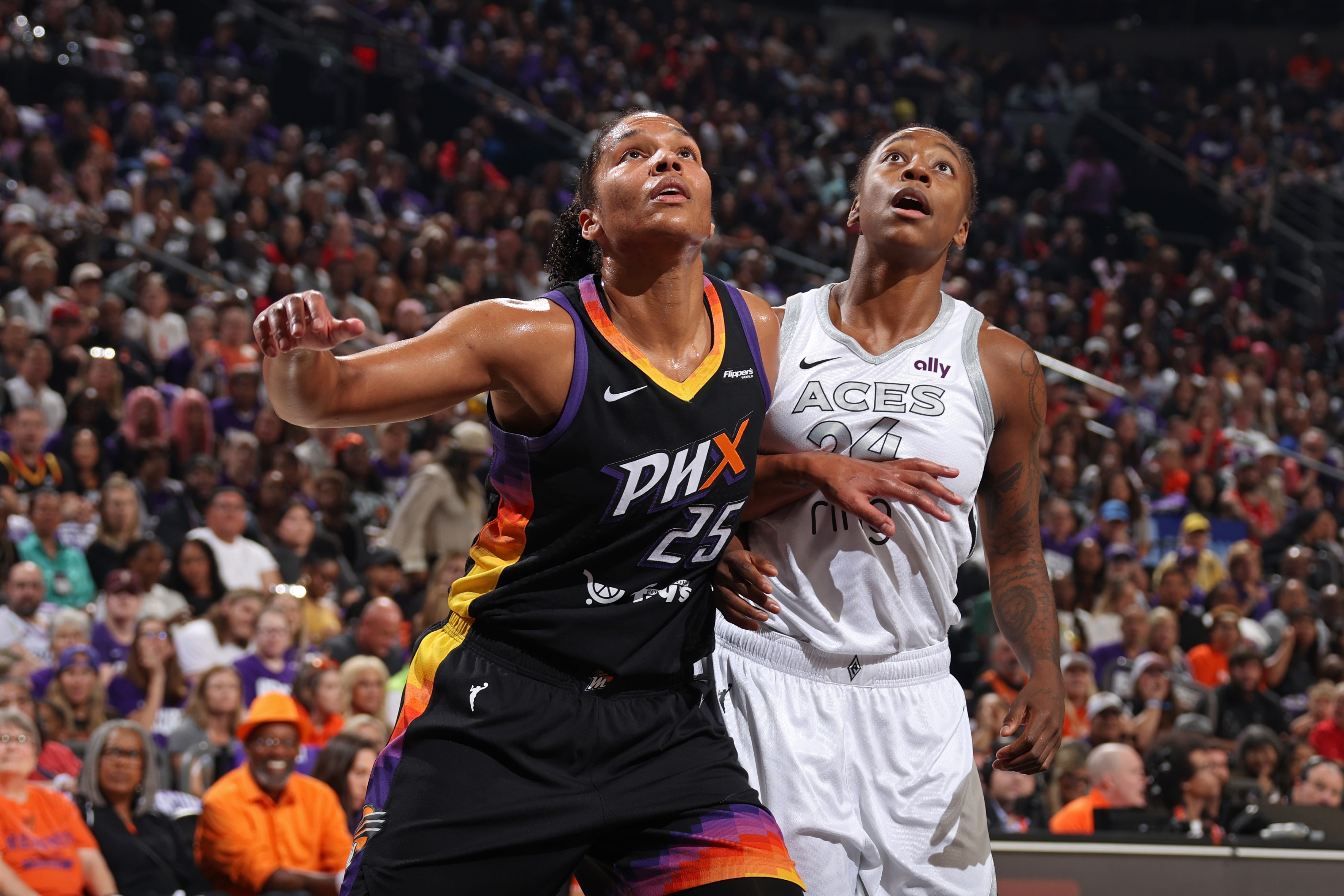 Alyssa Thomas #25 of the Phoenix Mercury and Jewell Loyd #24 of the Las Vegas Aces wait for the rebound