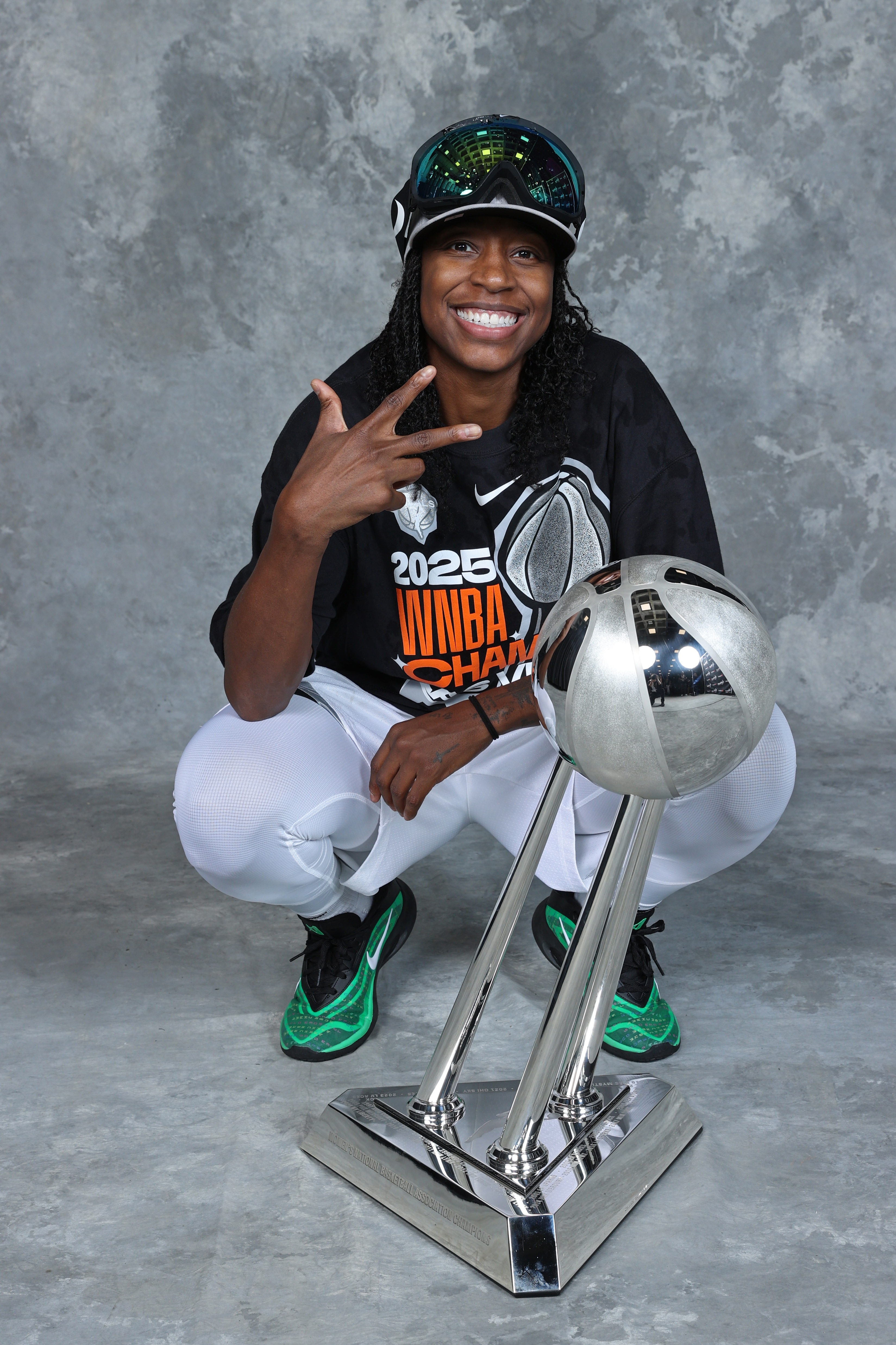 Jewell Loyd #24 of the Las Vegas Aces poses for a portrait with the 2025 WNBA Championship trophy