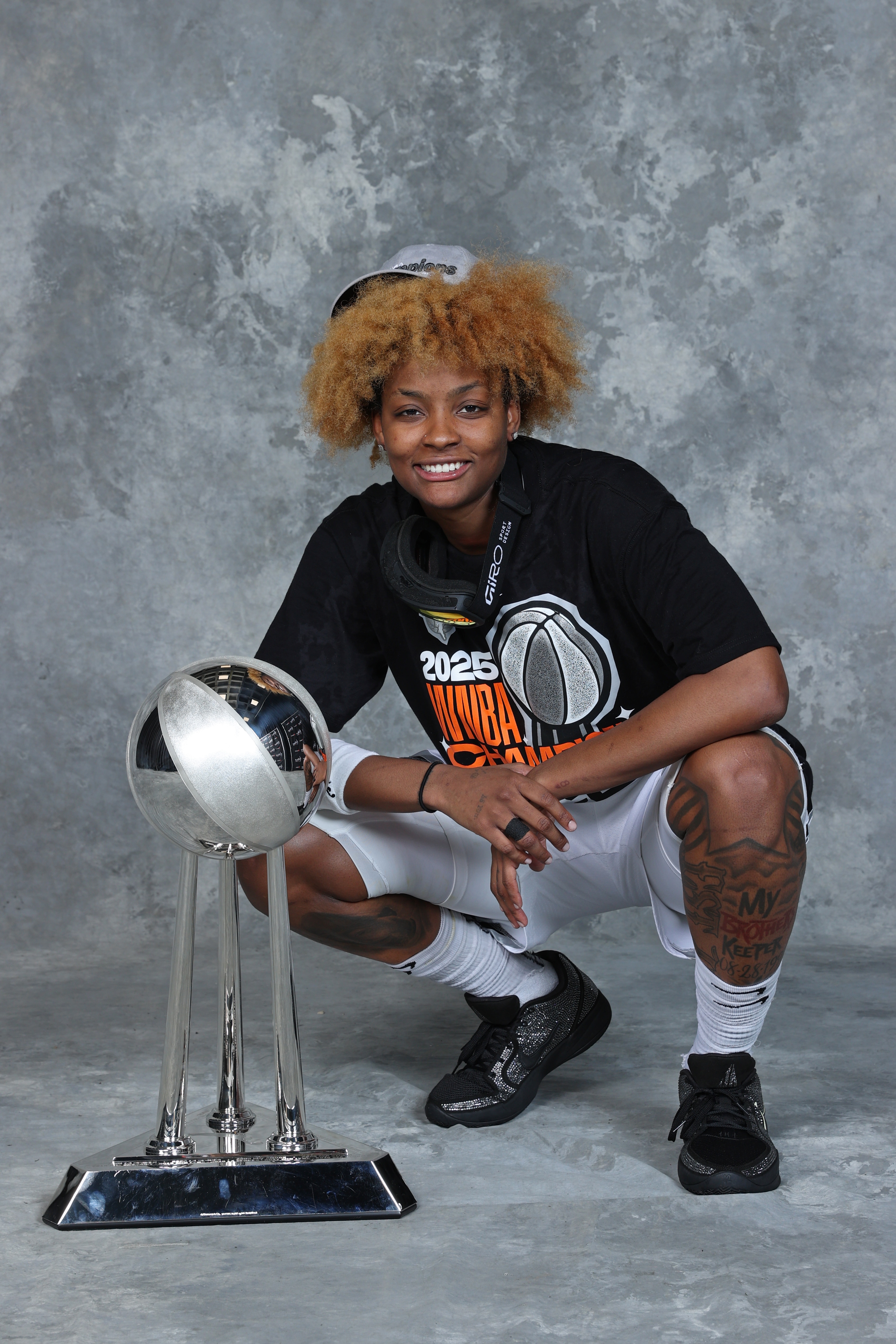 NaLyssa Smith #3 of the Las Vegas Aces poses for a portrait with the 2025 WNBA Championship trophy