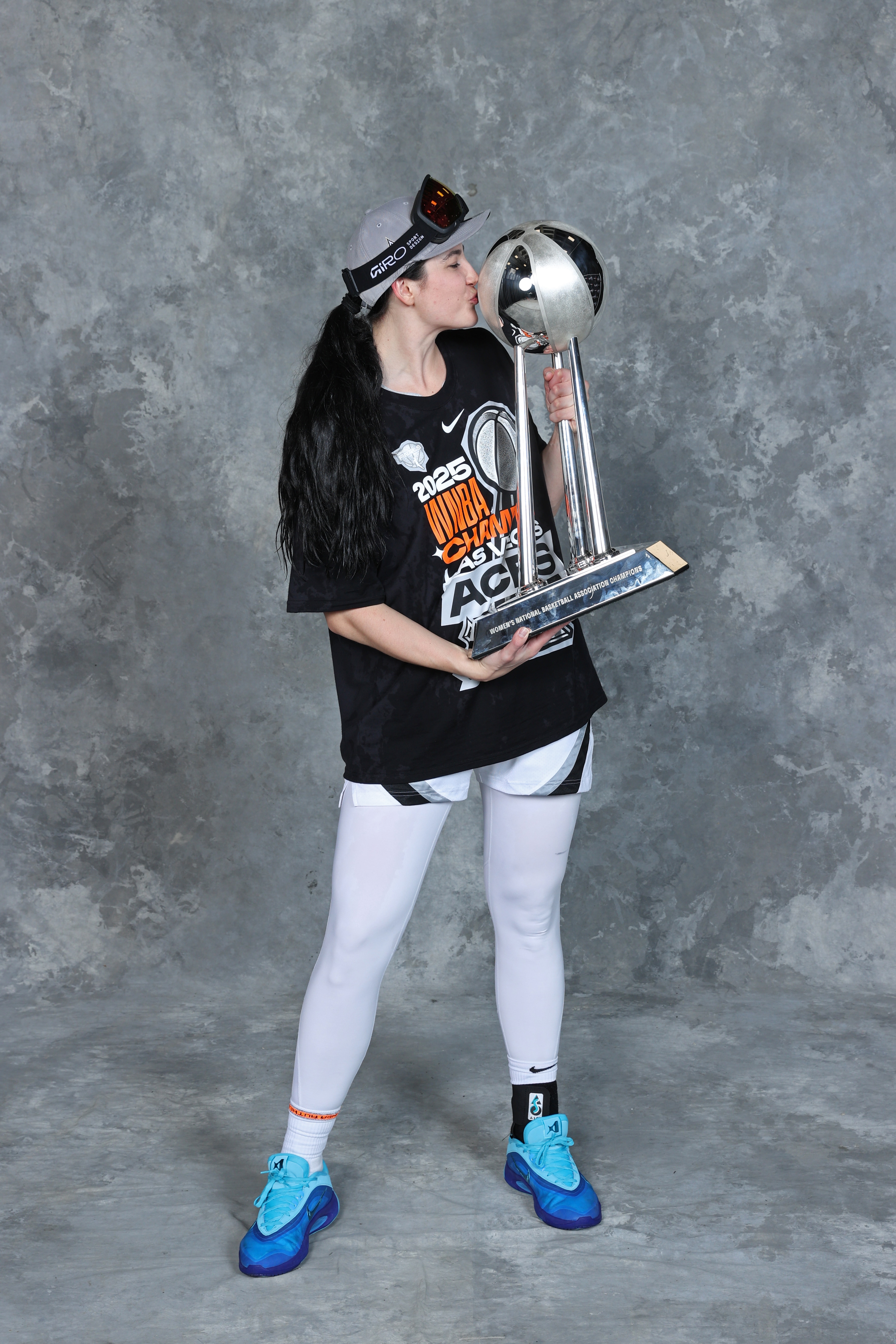 Megan Gustafson #17 of the Las Vegas Aces poses for a portrait with the 2025 WNBA Championship trophy