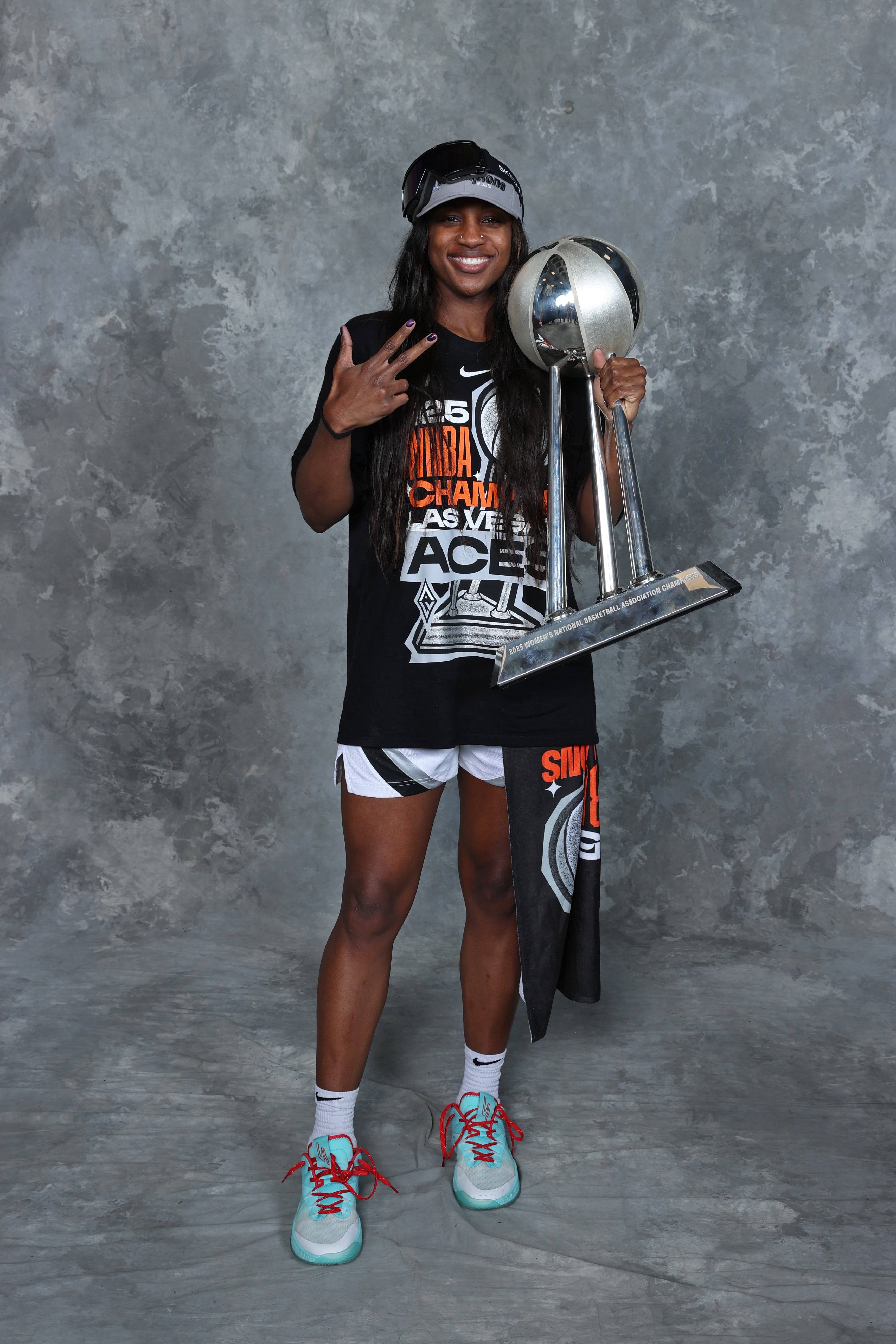 Jackie Young #0 of the Las Vegas Aces poses for a portrait with the 2025 WNBA Championship trophy