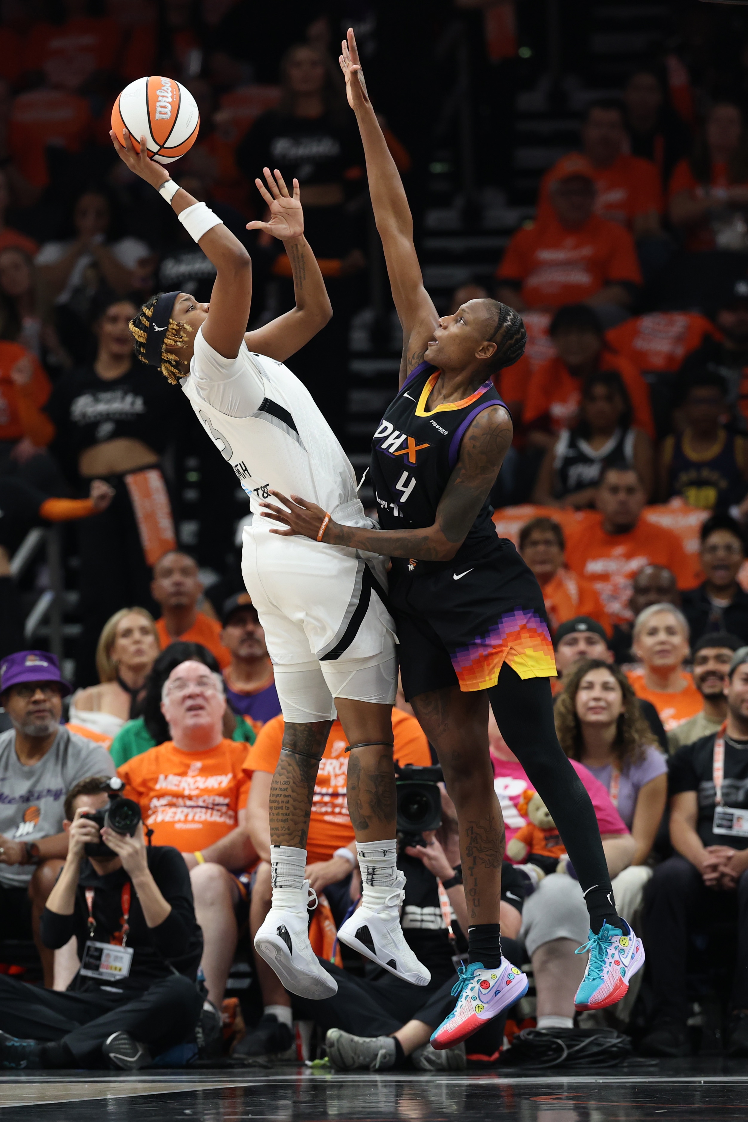 NaLyssa Smith #3 of the Las Vegas Aces shoots the ball against Natasha Mack #4 of the Phoenix Mercury