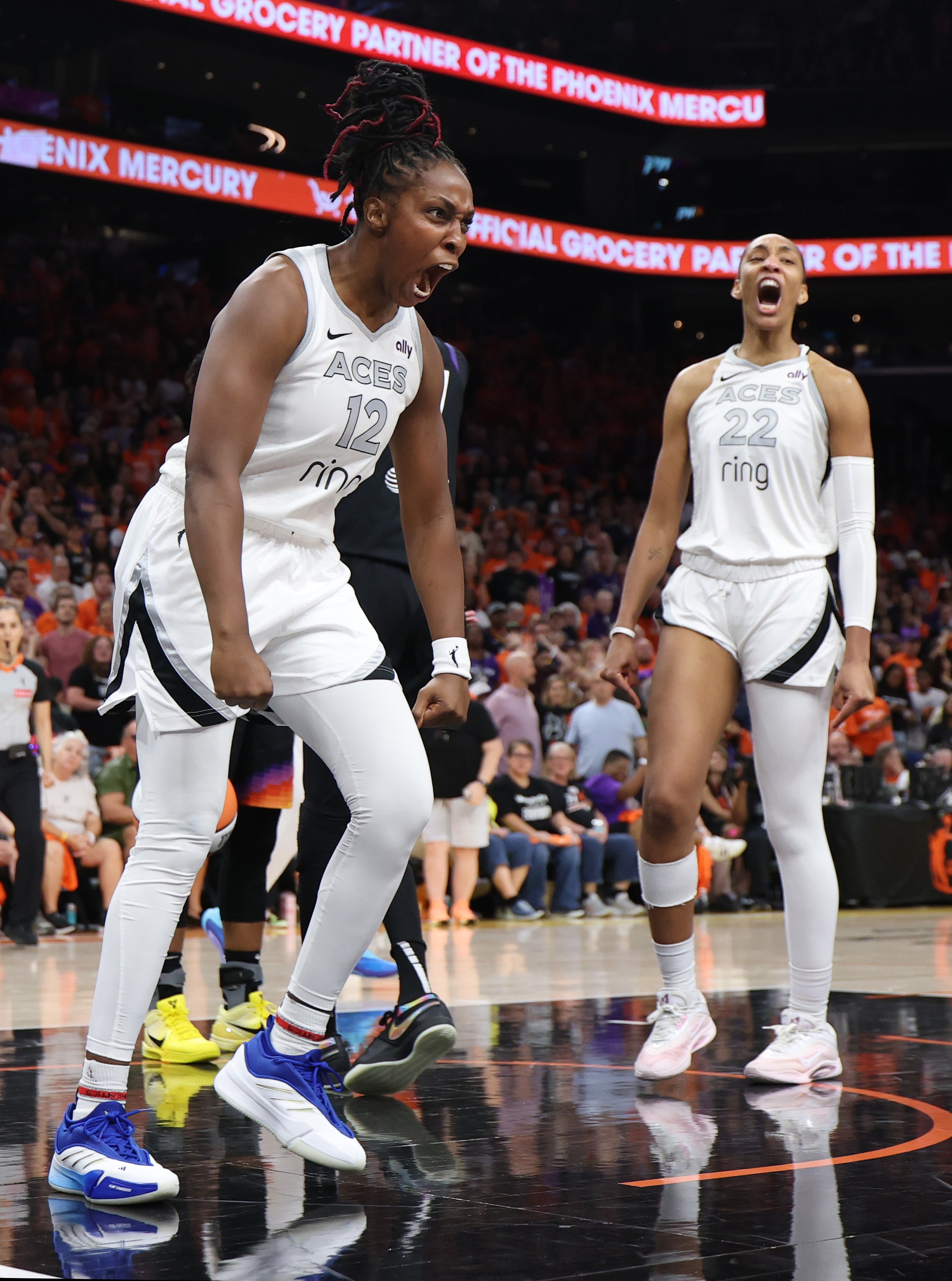 Chelsea Gray #12 of the Las Vegas Aces celebrates her made basket against the Phoenix Mercury