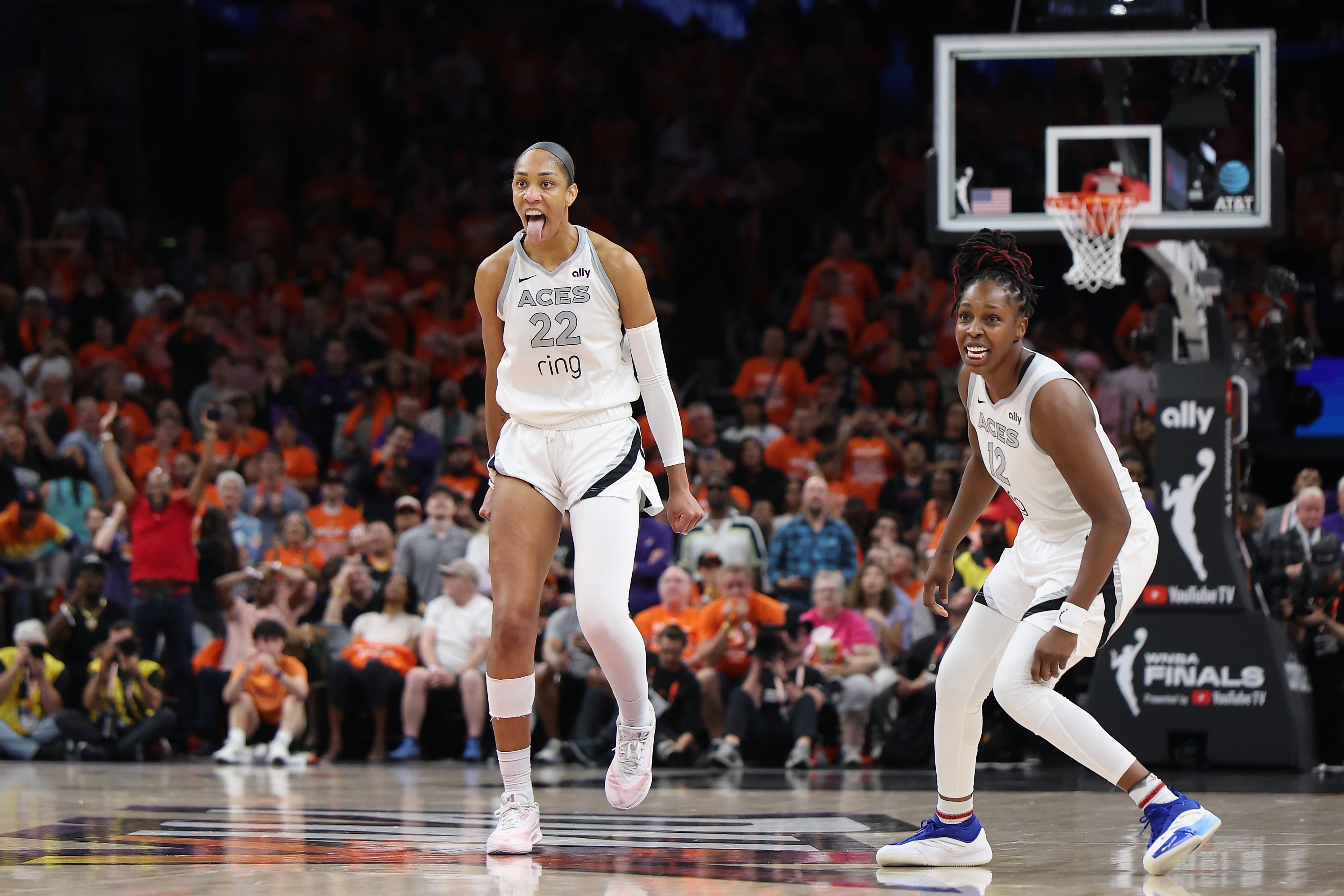 A'ja Wilson #22 of the Las Vegas Aces reacts with Chelsea Gray #12 after her made basket against the Phoenix Mercury with less than one second left in the fourth quarter