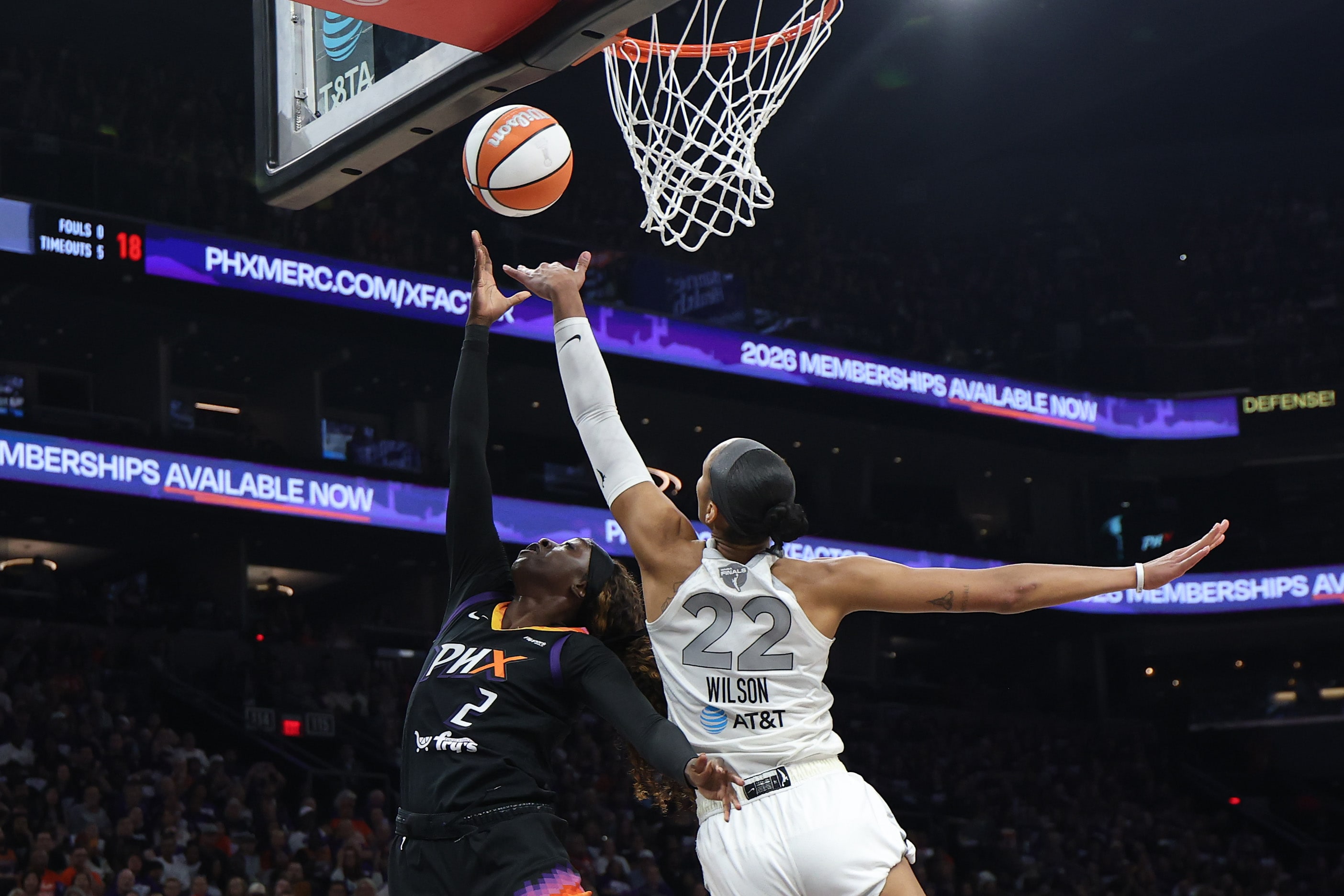 A'ja Wilson #22 of the Las Vegas Aces blocks the shot of Kahleah Copper #2 of the Phoenix Mercury