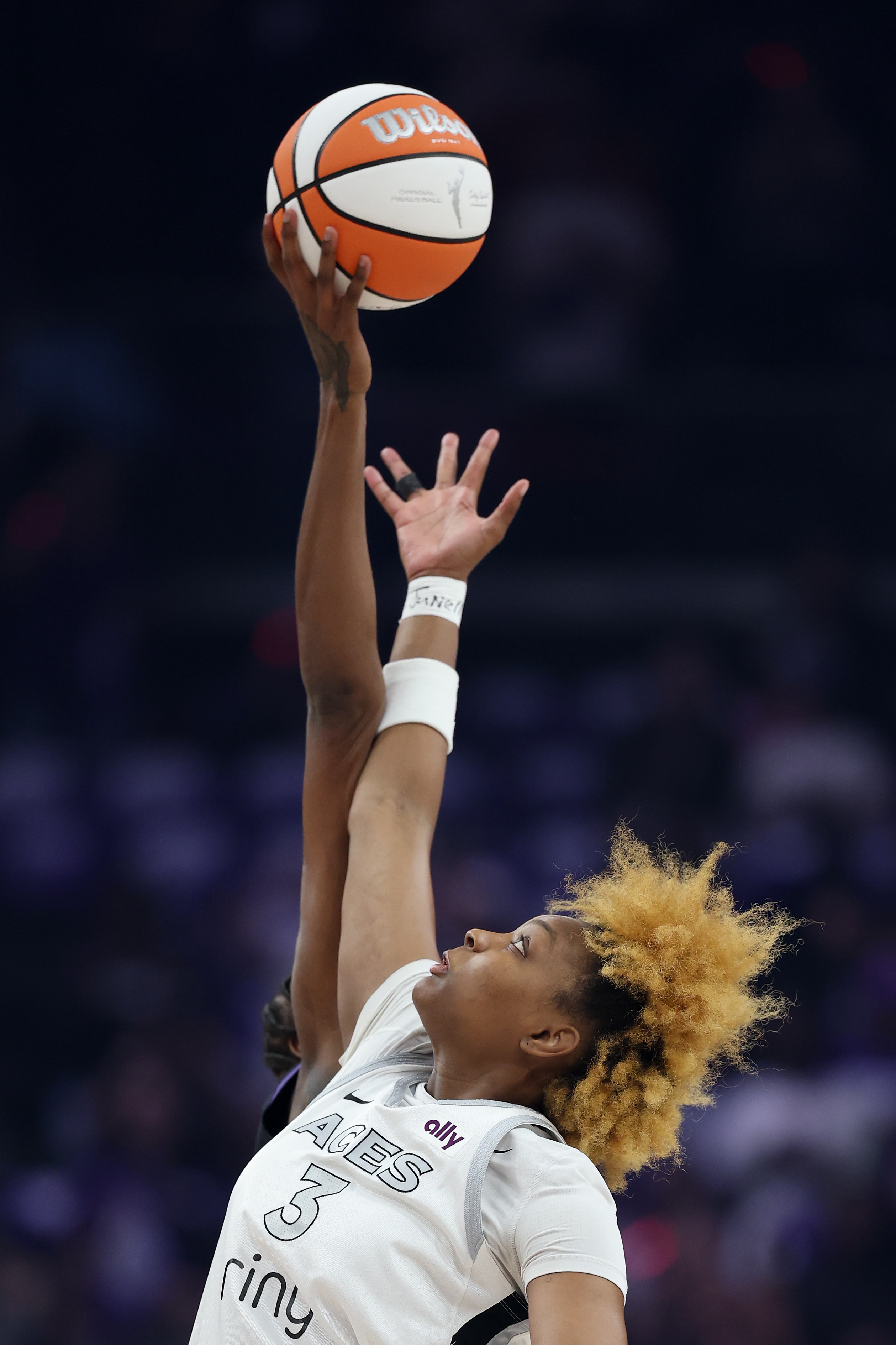 NaLyssa Smith #3 of the Las Vegas Aces jumps during the opening tip off in the first quarter against the Phoenix Mercury