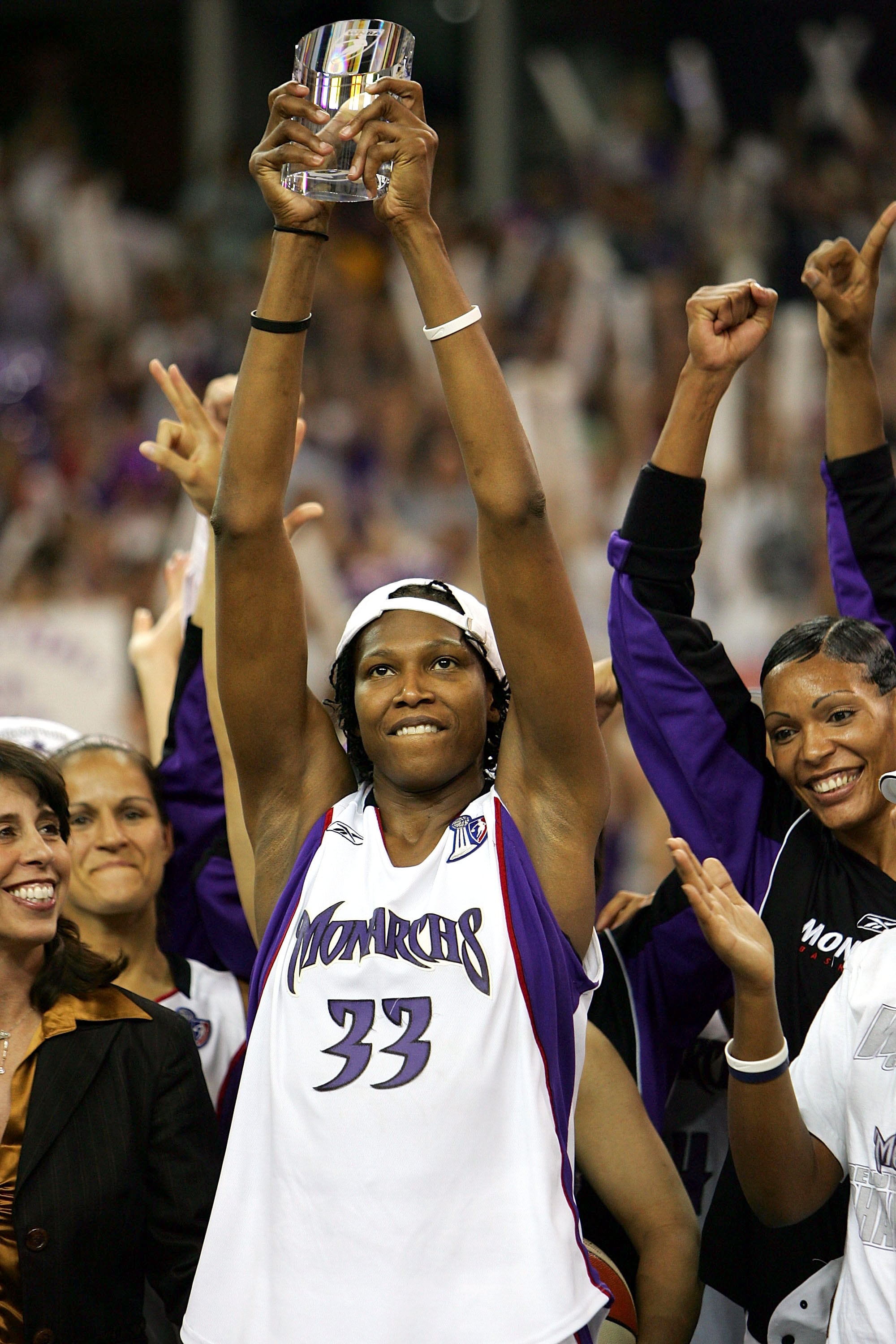 Yolanda Griffith #33 of the Sacramento Monarchs celebrates with the MVP trophy after defeating the Connecticut Sun during Game 4 of the WNBA Finals