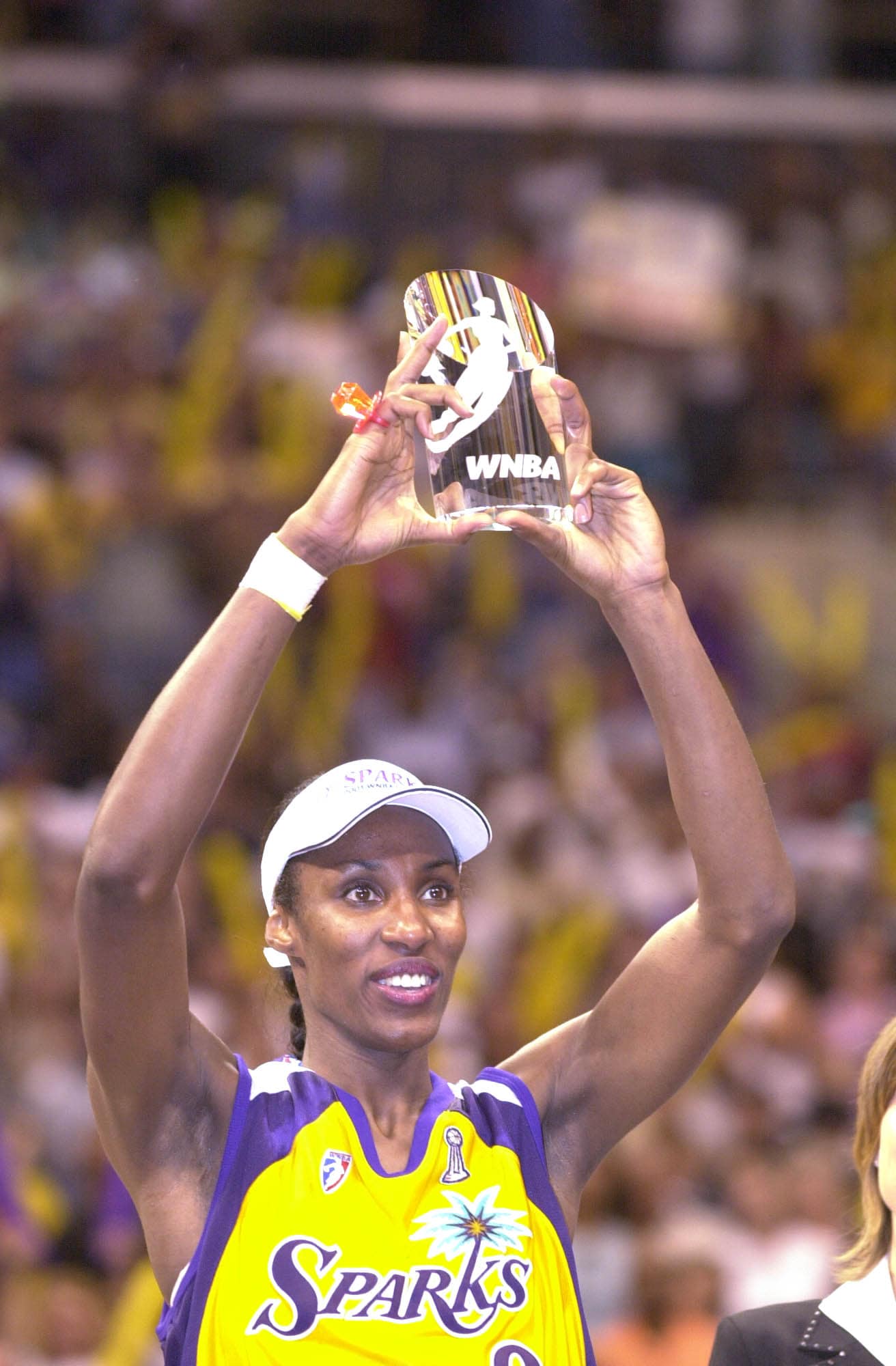 Lisa Leslie #9 of the Los Angeles Sparks holds the 2001 Finals MVP trophy after defeating the Charlotte Sting in game two of the WNBA Finals