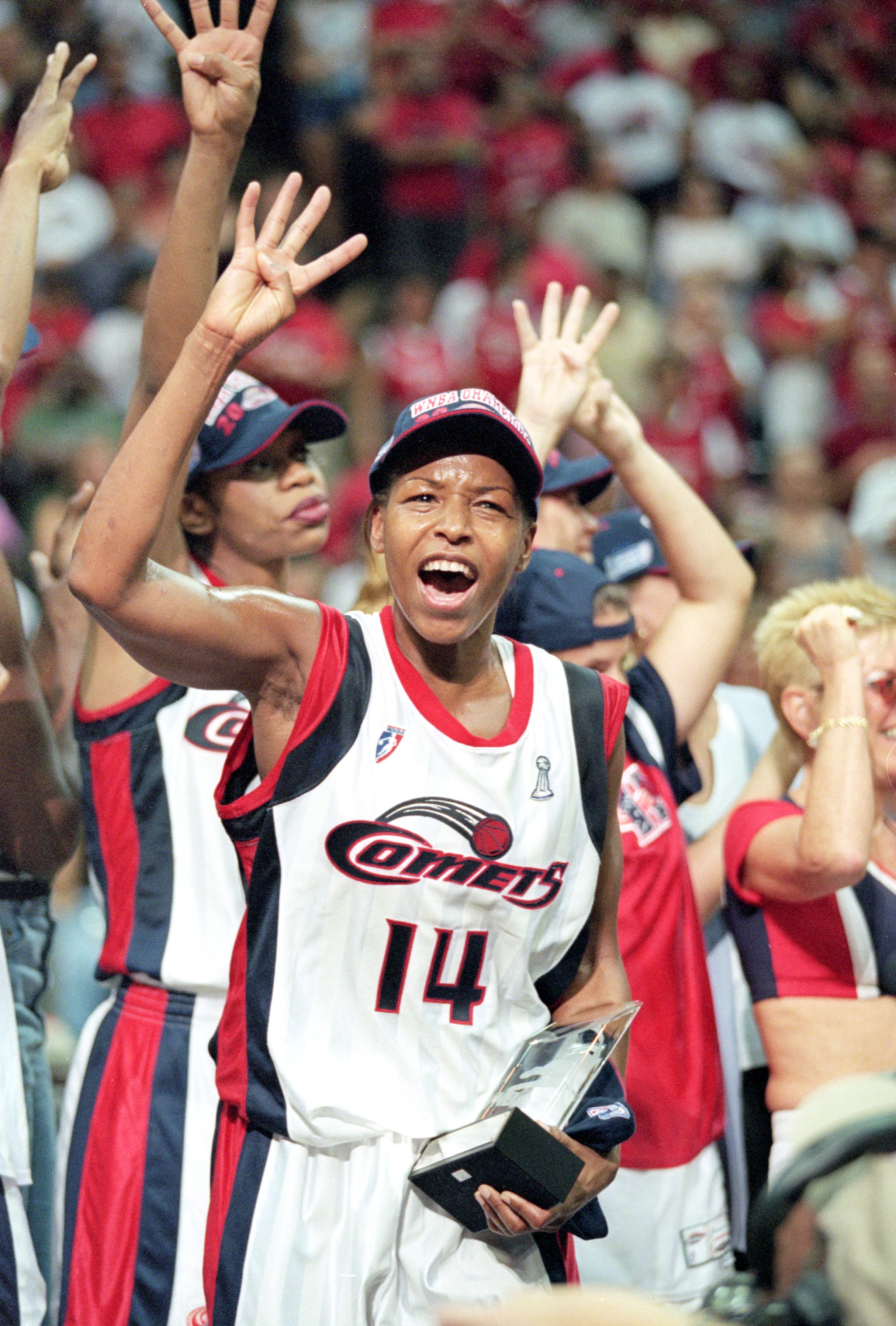 Cynthia Cooper #14 of the Houston Comets celebrates after winning the game against the New York Liberty in the WNBA Finals