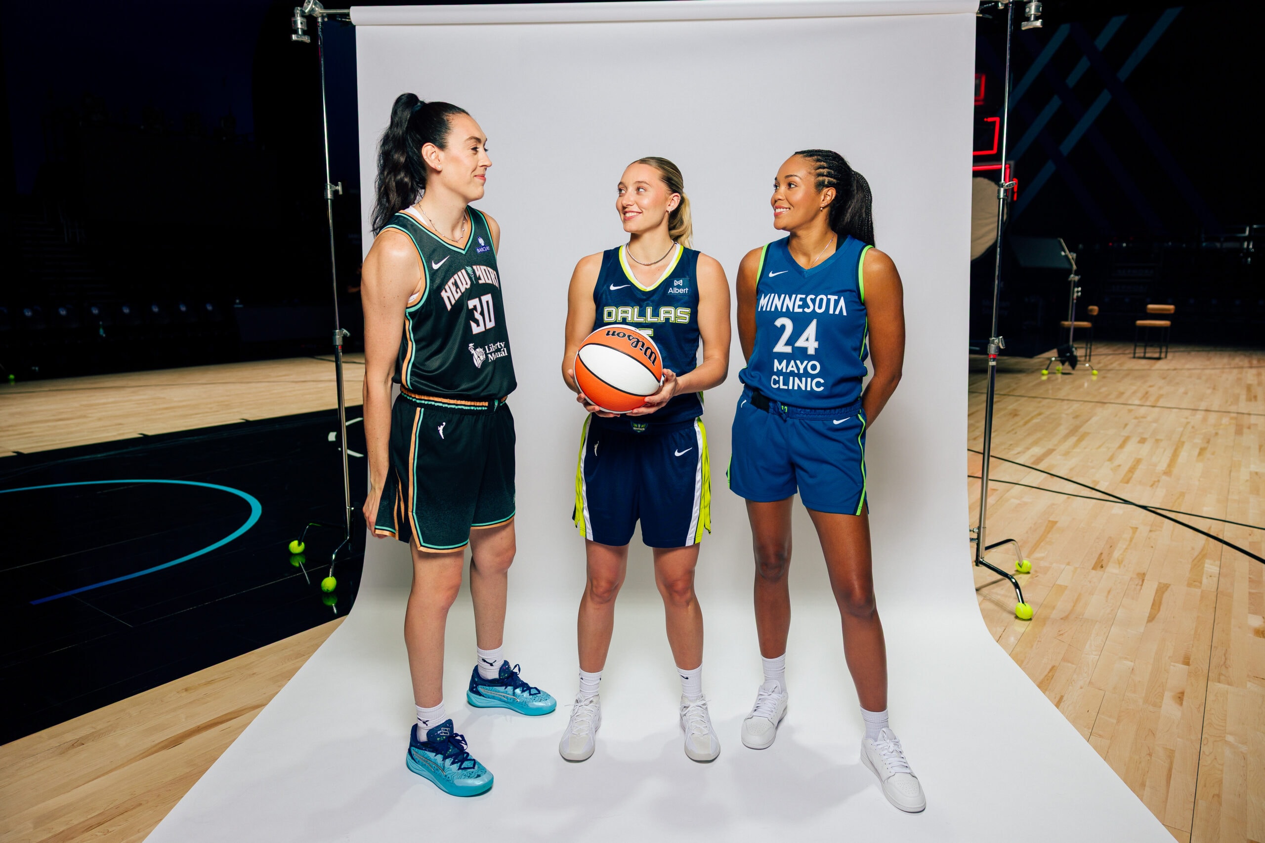 Image of WNBA players Breanna Stewart, Paige Bueckers & Napheesa Collier standing with a basketball. Ally Do It Right Logo.