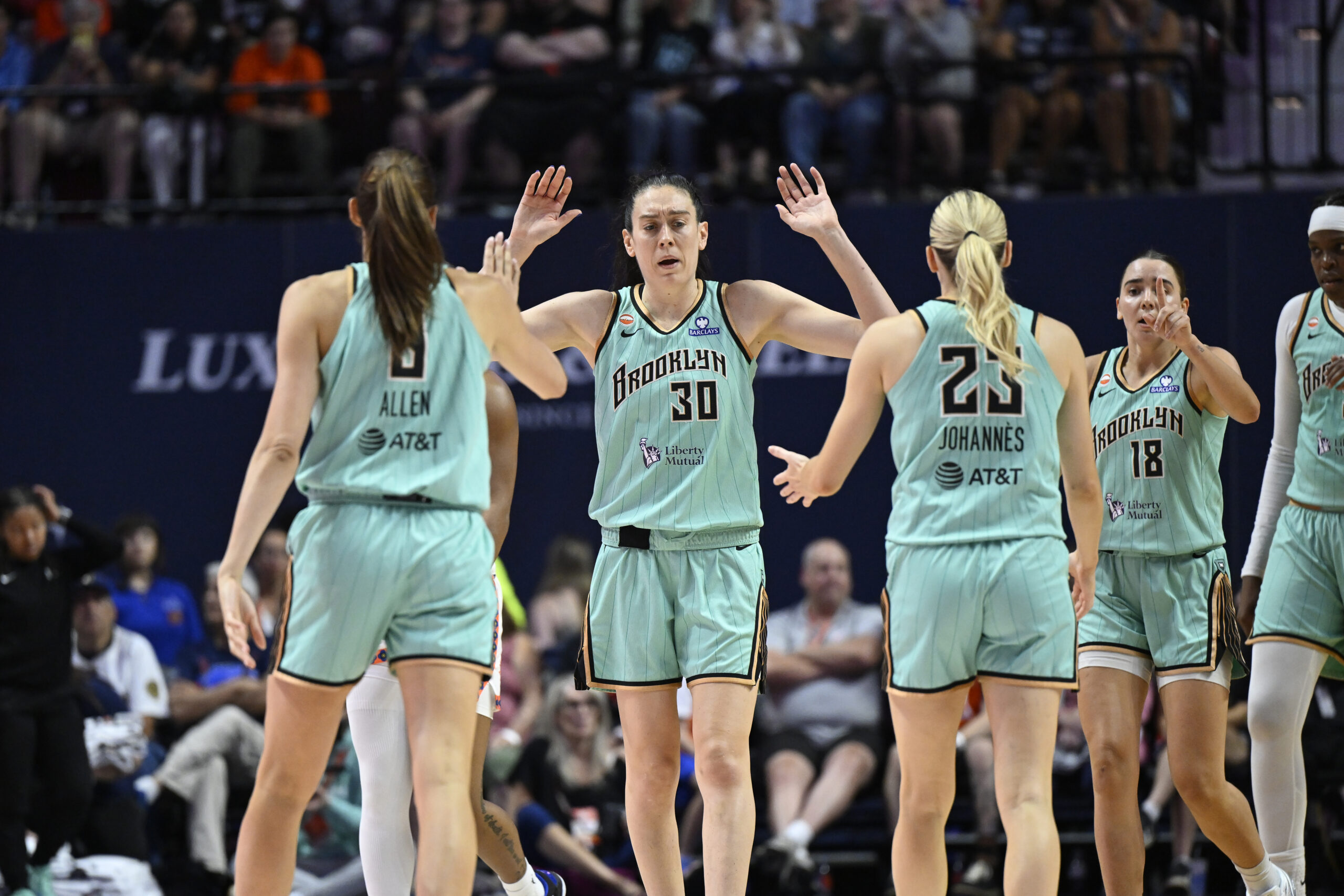 Breanna Stewart #30, Rebecca Allen #9, and Marine Johannes #23 of the New York Liberty