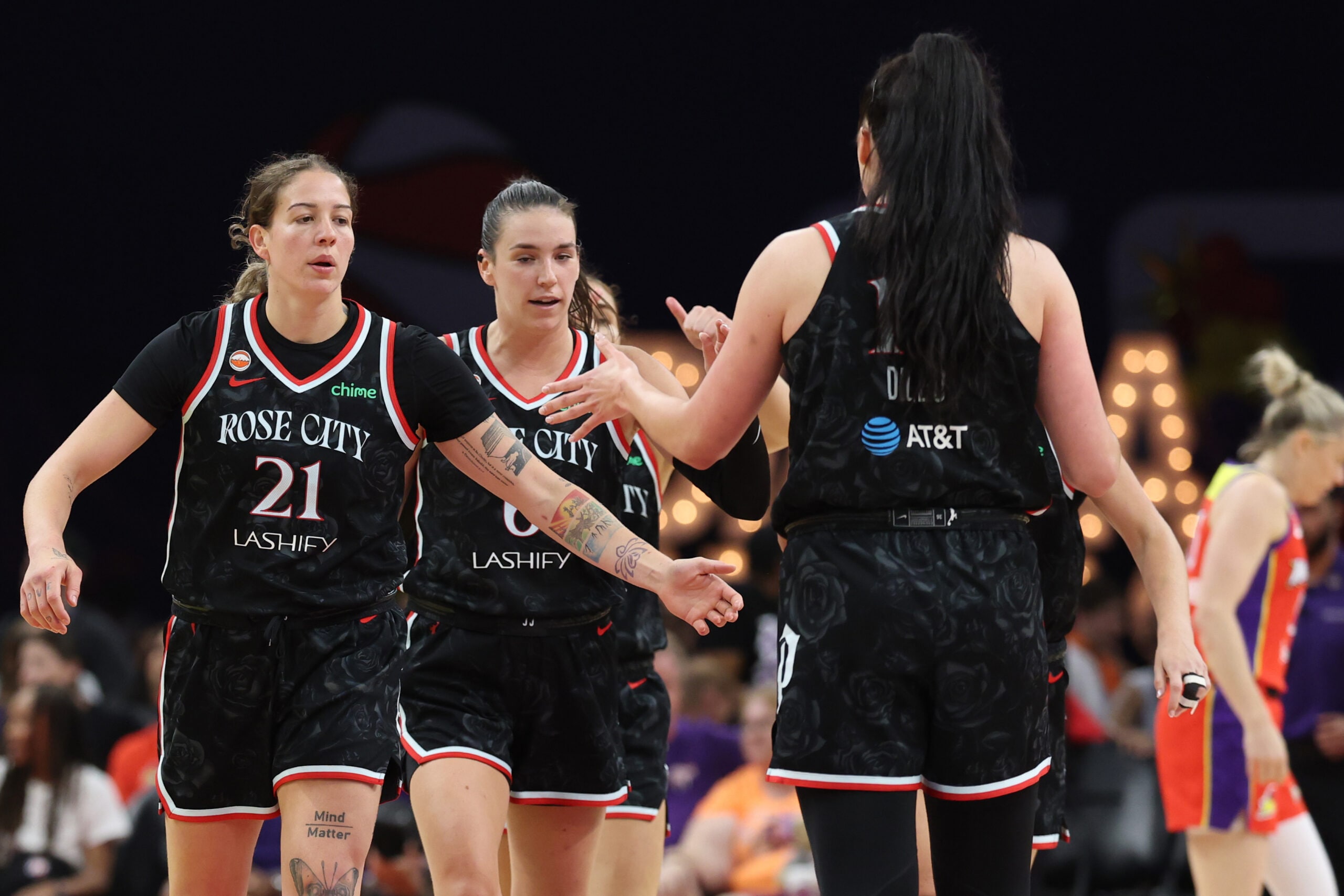Emily Engstler #21 of the Portland Fire high fives teammates