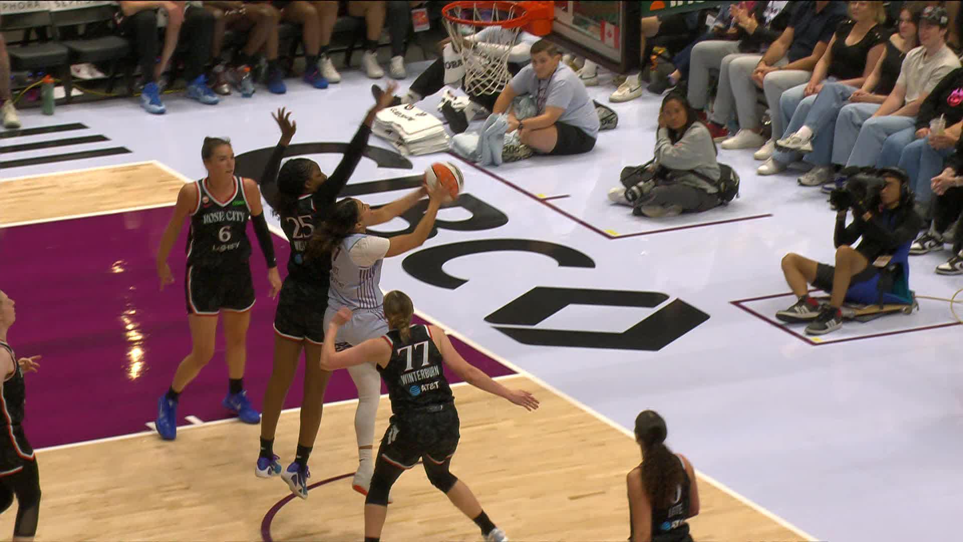 Kiki Rice scores and draws the foul
