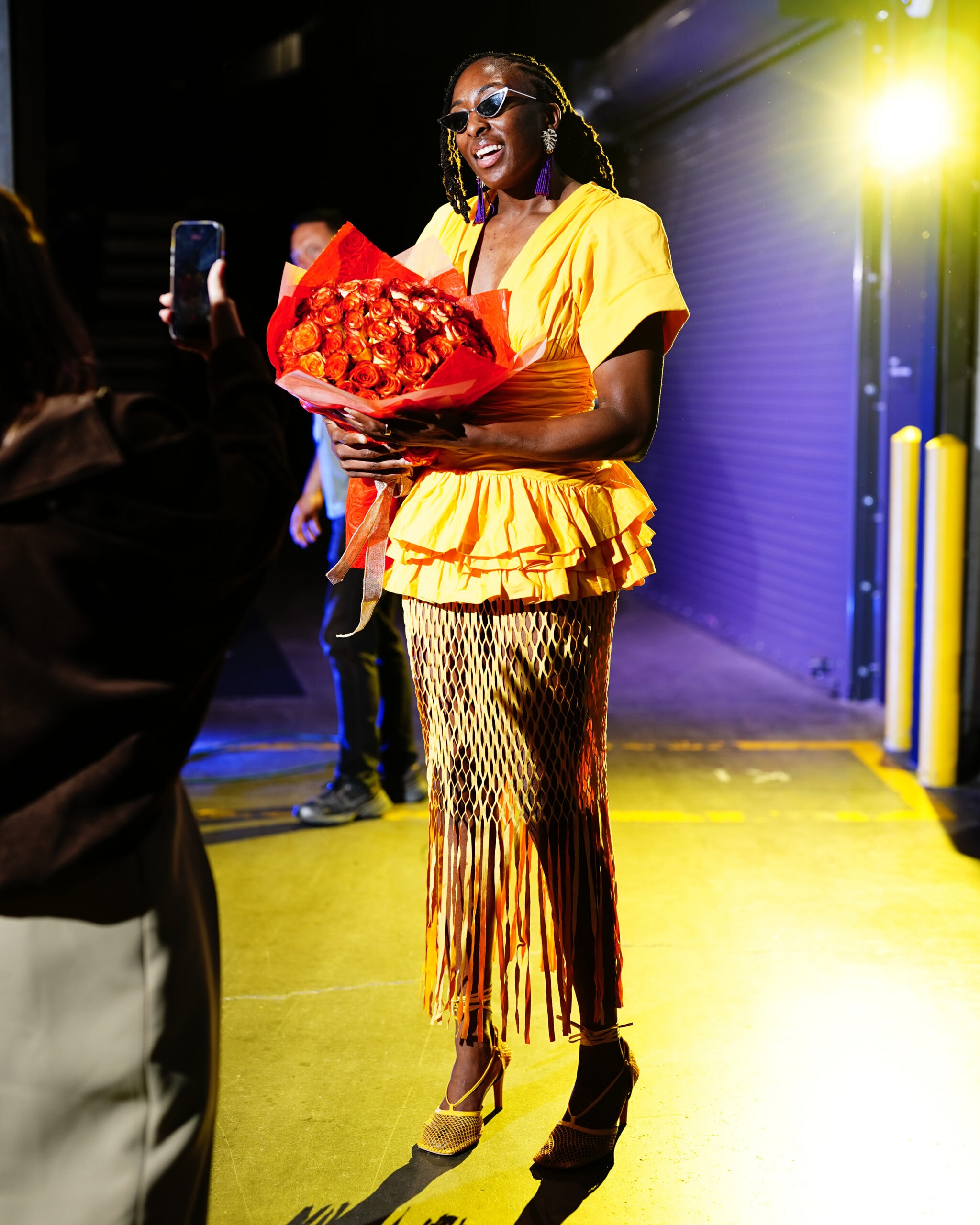 Nneka Ogwumike holding flowers at her 2026 WNBA farewell celebration