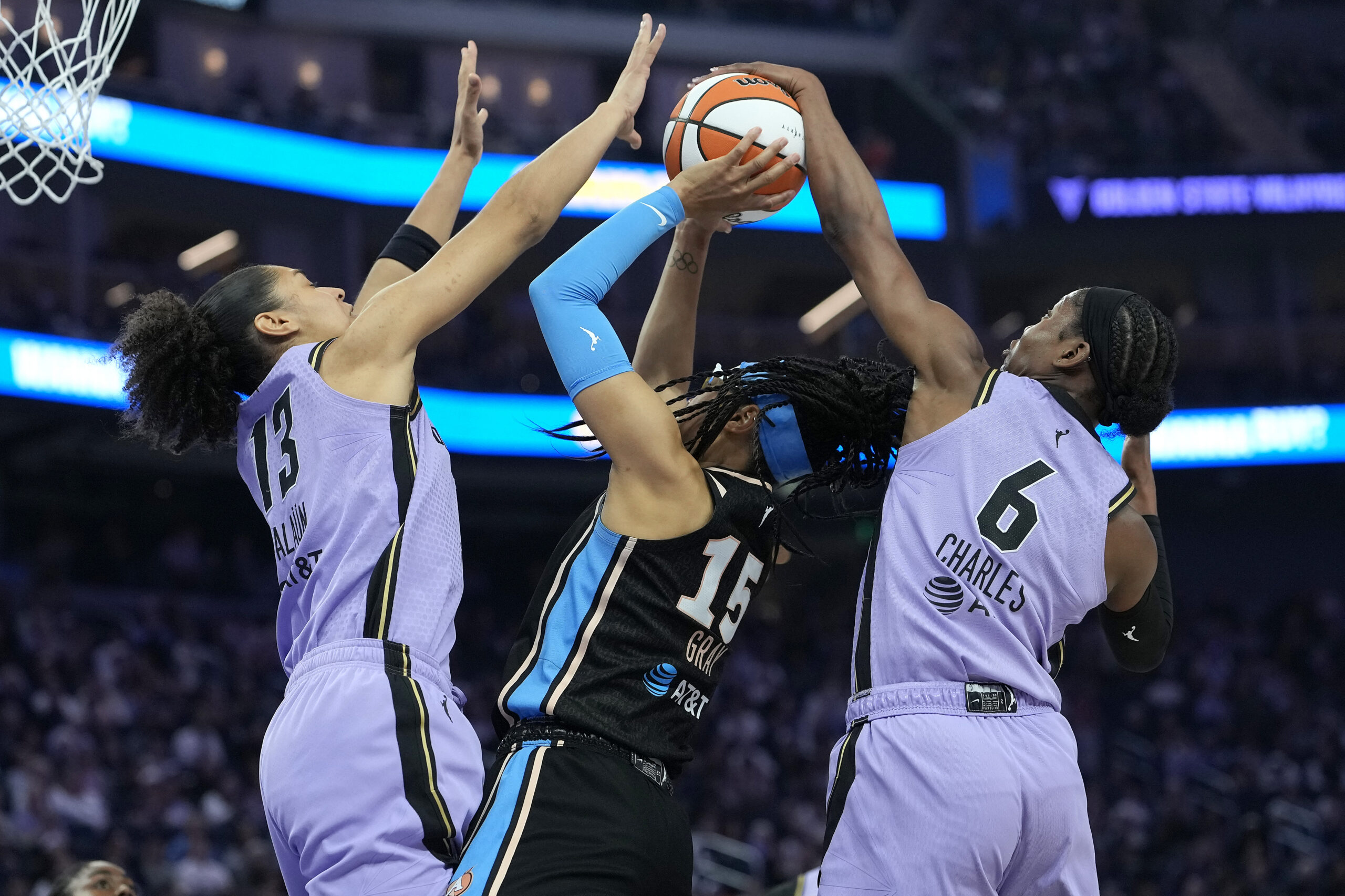 Atlanta Dream player drives past a Golden State Valkyries defender